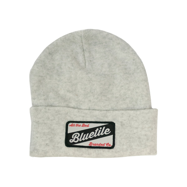 A grey BLUETILE CRAFT PATCH BEANIE HEATHER WHITE with a blueville PATCH by Bluetile Skateboards.