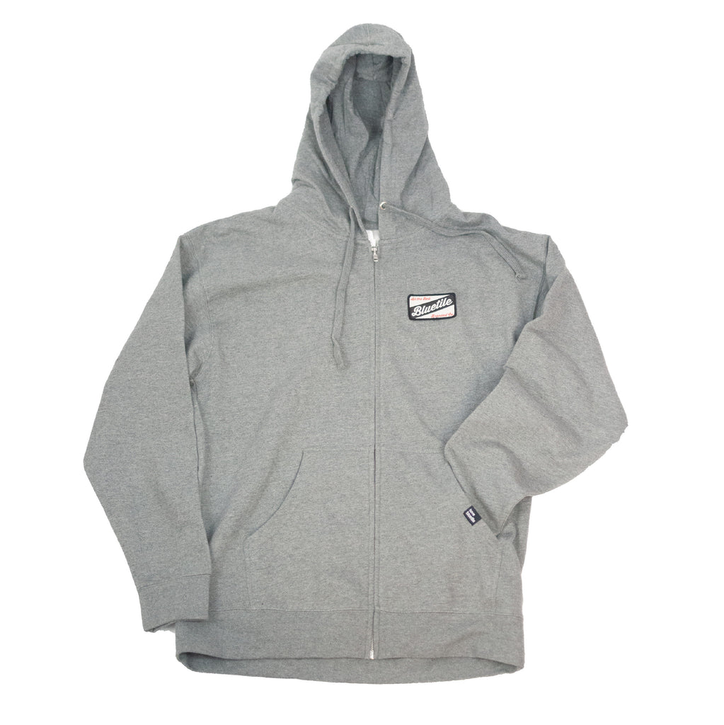 A BLUETILE CRAFT ZIP HOODIE GREY with the Bluetile Skateboards logo on it.