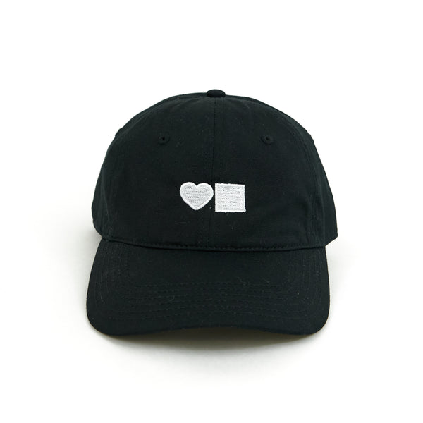 A BLUETILE LOVE SIX PANEL HAT BLACK hat with a white heart on it, featuring a six-panel design.