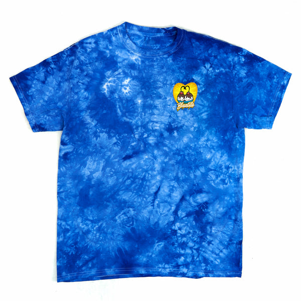 A BLUETILE MUNCHIES DELIVERY TIEDYE T-SHIRT BLUE with a yellow logo on it by Bluetile Skateboards.