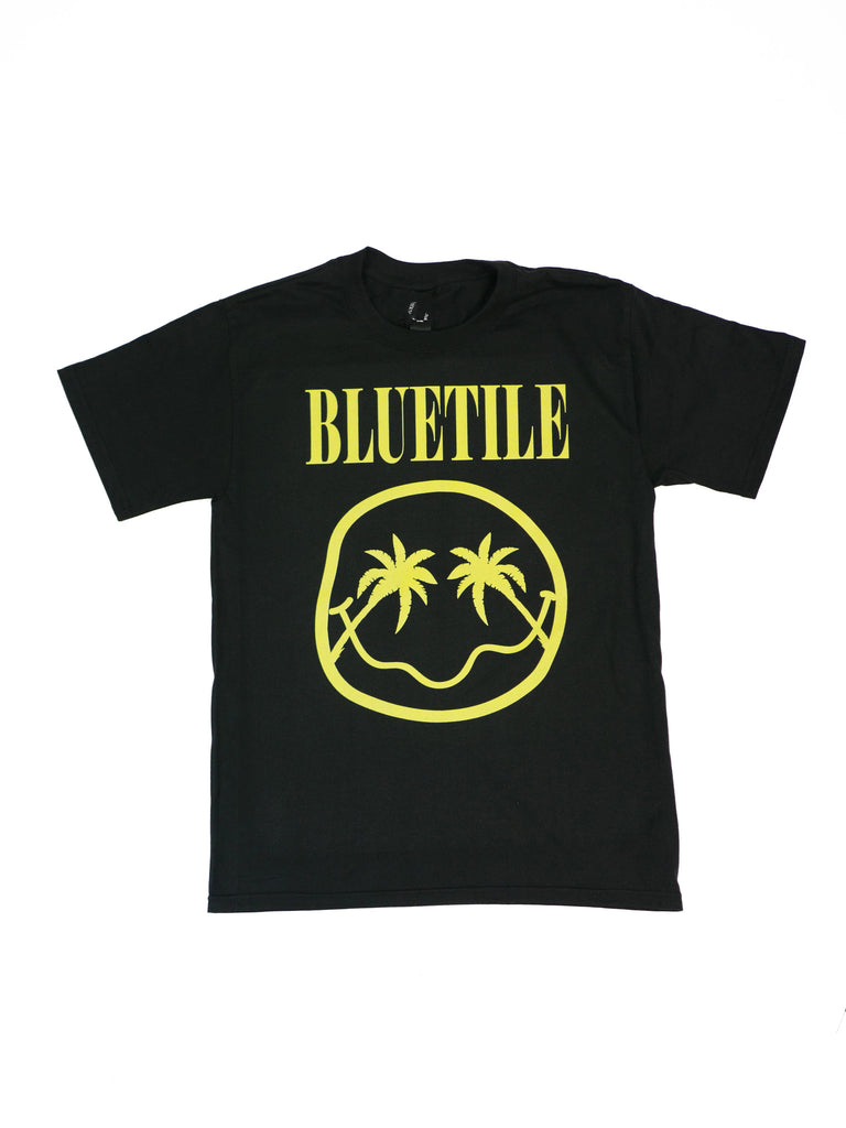 A BLUETILE PALMETTO SMILES T-SHIRT BLACK with a yellow smiley face on it made by Bluetile Skateboards.