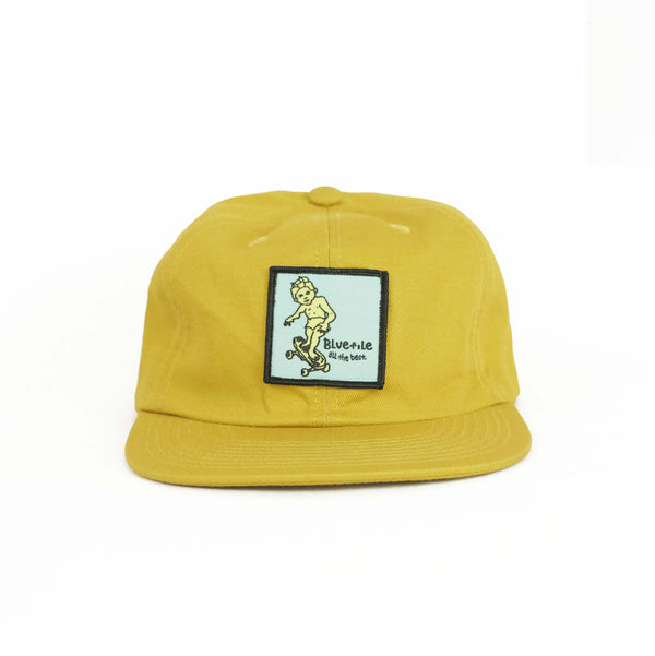 A Bluetile Skateboards maize hat with a BLUETILE SKETCHY PATCH on it.