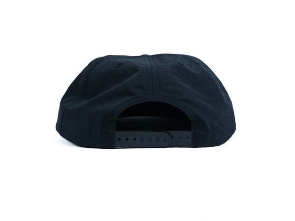 The back view of a black BLUETILE SUPPLY CO NYLON SURF HAT BLACK from Bluetile Skateboards.