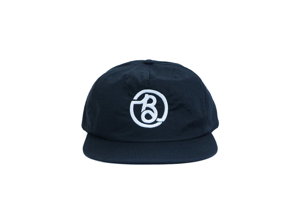 A BLUETILE SUPPLY CO NYLON SURF HAT BLACK with the letter b on it is offered by Bluetile Skateboards.