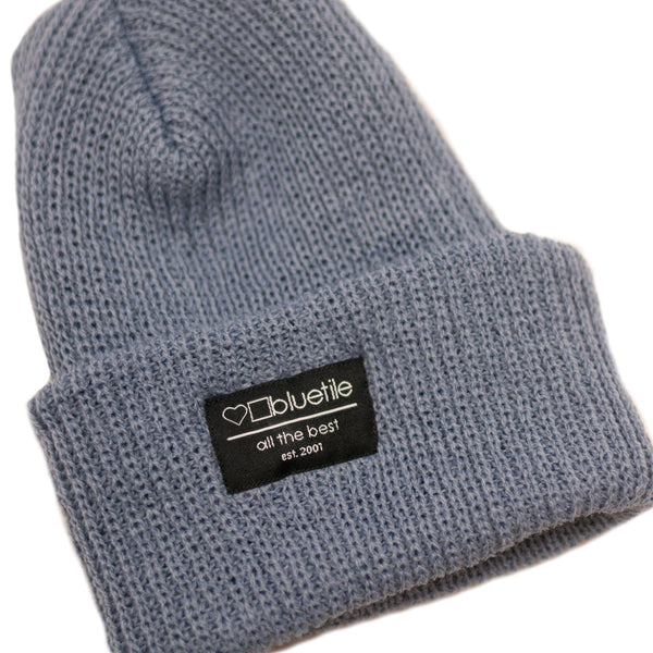 A Bluetile Skateboards blue knit beanie.