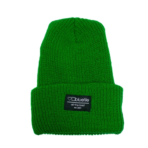 A Bluetile Skateboards BLUETILE SURPLUS KNIT BEANIE KELLY GREEN with a label on it.