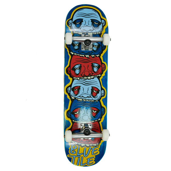 A skateboard with four faces on it, featuring the BLUETILE YUPYUK 8.5 COMPLETE (VARIOUS STAINS) WHEELS for smooth rides.