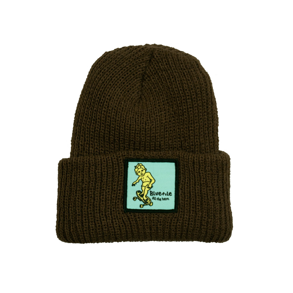 A Bluetile Skateboards BLUETILE X GONZ SKETCHY PATCH BEANIE OLIVE with a yellow patch on it, featuring the Gonz Sketchy Patch.