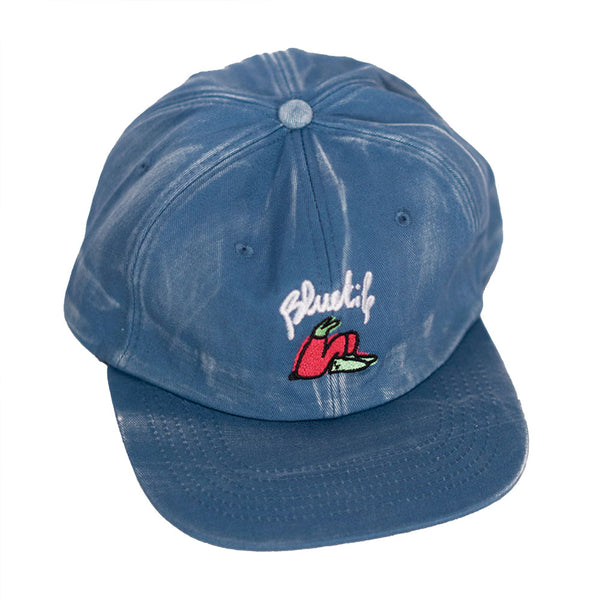 A Bluetile Skateboards BLUETILE X LUCAS BEAUFORT HAT FADED BLUE with a flower on it.