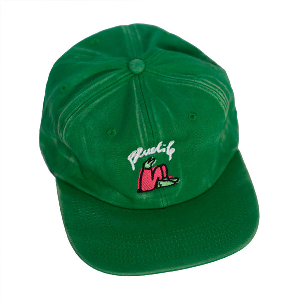 A Bluetile Skateboards BLUETILE X LUCAS BEAUFORT HAT FADED GREEN with a pink flower on it, perfect for the 20th anniversary celebration.