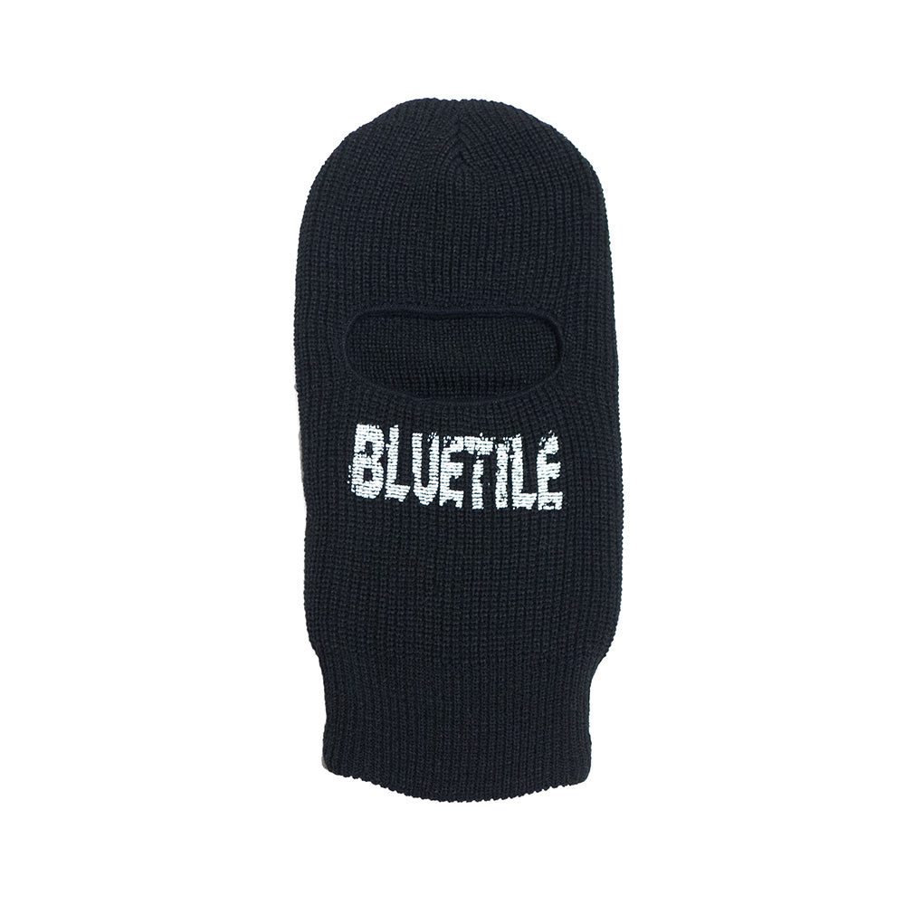 A black BLUETILE BALACLAVA BLACK with the word blurtle on it, made by Bluetile Skateboards.