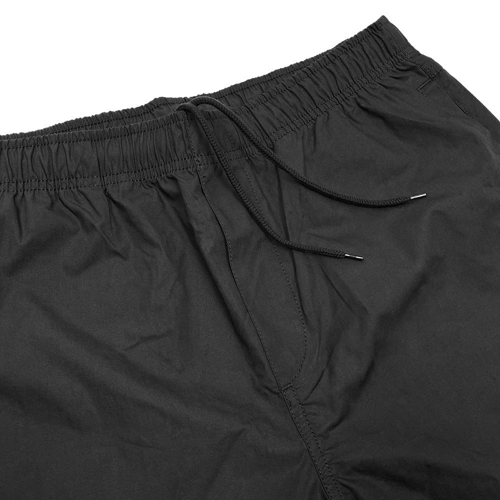 A pair of Bluetile Surplus Beach Short Black shorts with an elastic waistband, perfect for the beach.
