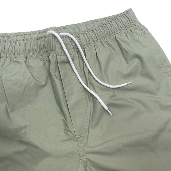 A pair of Bluetile Skateboards BLUETILE SURPLUS BEACH SHORT PISTACHIO shorts with white drawstrings.