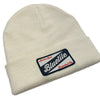 A white BLUETILE CRAFT PATCH BEANIE ECRU with a 'buzzle' PATCH on it from Bluetile Skateboards.