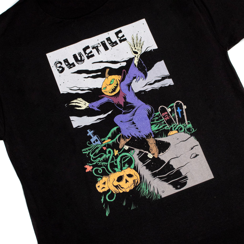 A BLUETILE DEATH RACE TEE BLACK with an image of a skeleton riding a skateboard by Bluetile Skateboards.