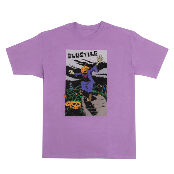 This BLUETILE DEATH RACE TEE PURPLE from Bluetile Skateboards features an image of a man riding a skateboard.