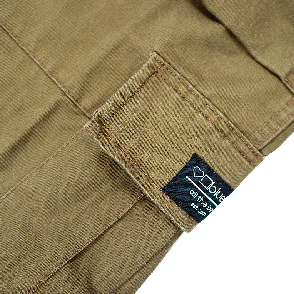 A BLUETILE FORAGER CARGO PANT RUSSET BROWN pair of cargo pants with utility pockets on the side. (Brand: Bluetile Skateboards)
