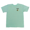 A BLUETILE X L.B. MAGICAL QUEST TEE TEAL with a dog embroidered on it.