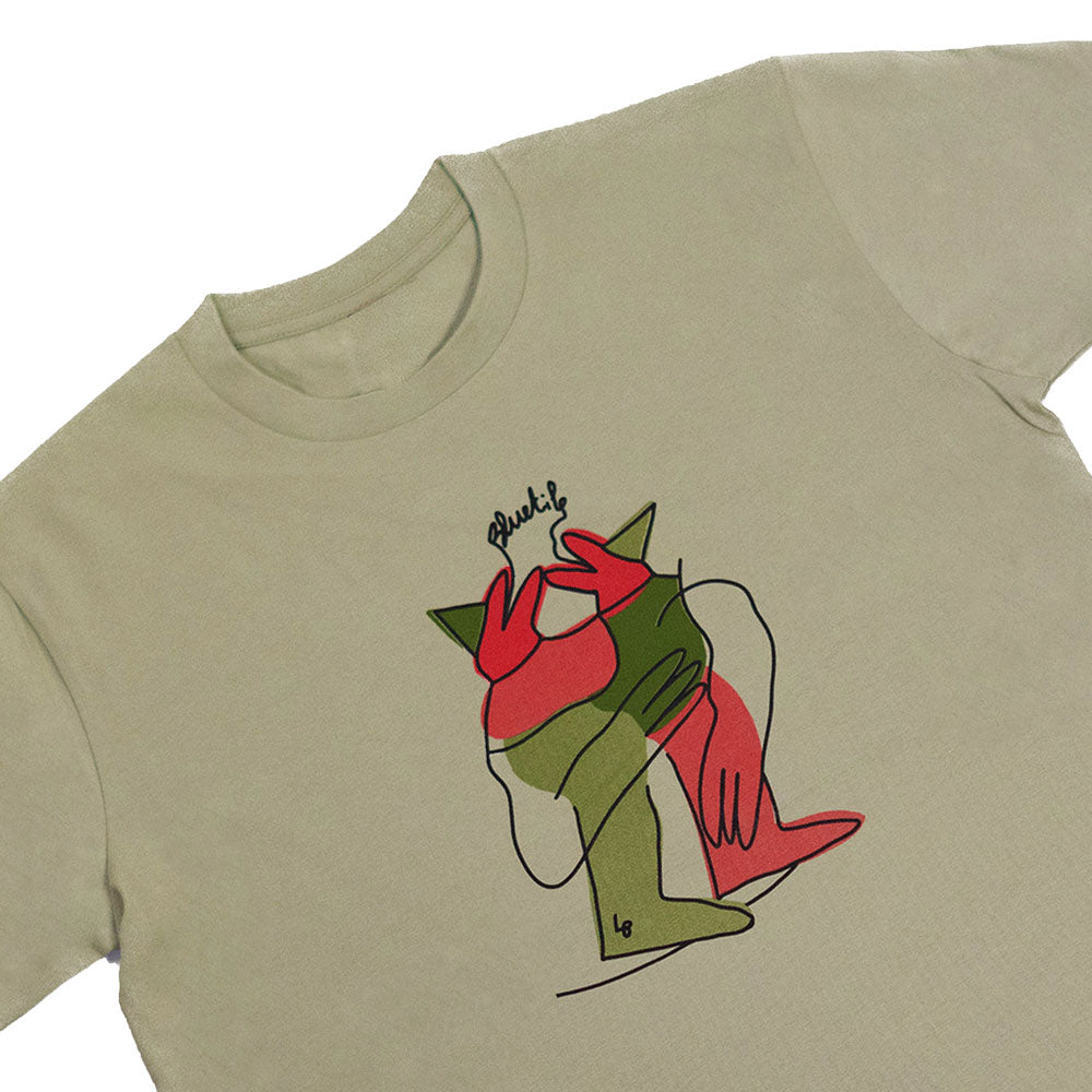 A BLUETILE X L.B. ANNIVERSARY PARTY TEE in olive green, featuring a drawing of a man sitting on a bench by Bluetile Skateboards.