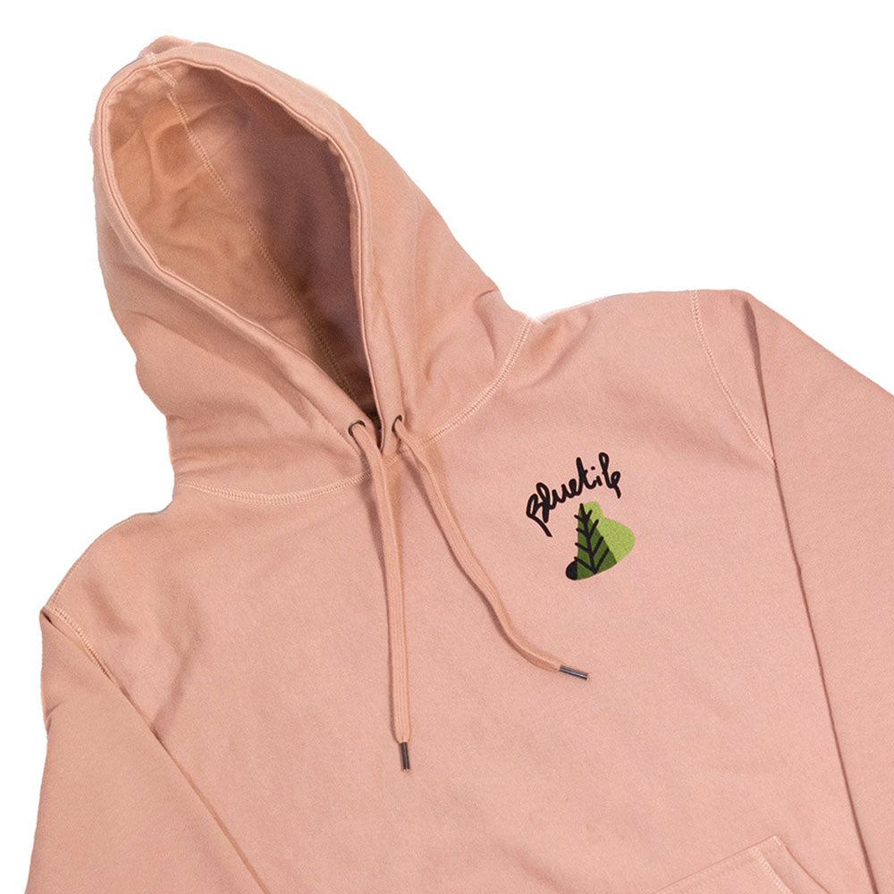 A Bluetile Skateboards X L.B. STILL GROWING HOODIE DUSTY PINK with dusty pink artwork featuring a green tree on it.
