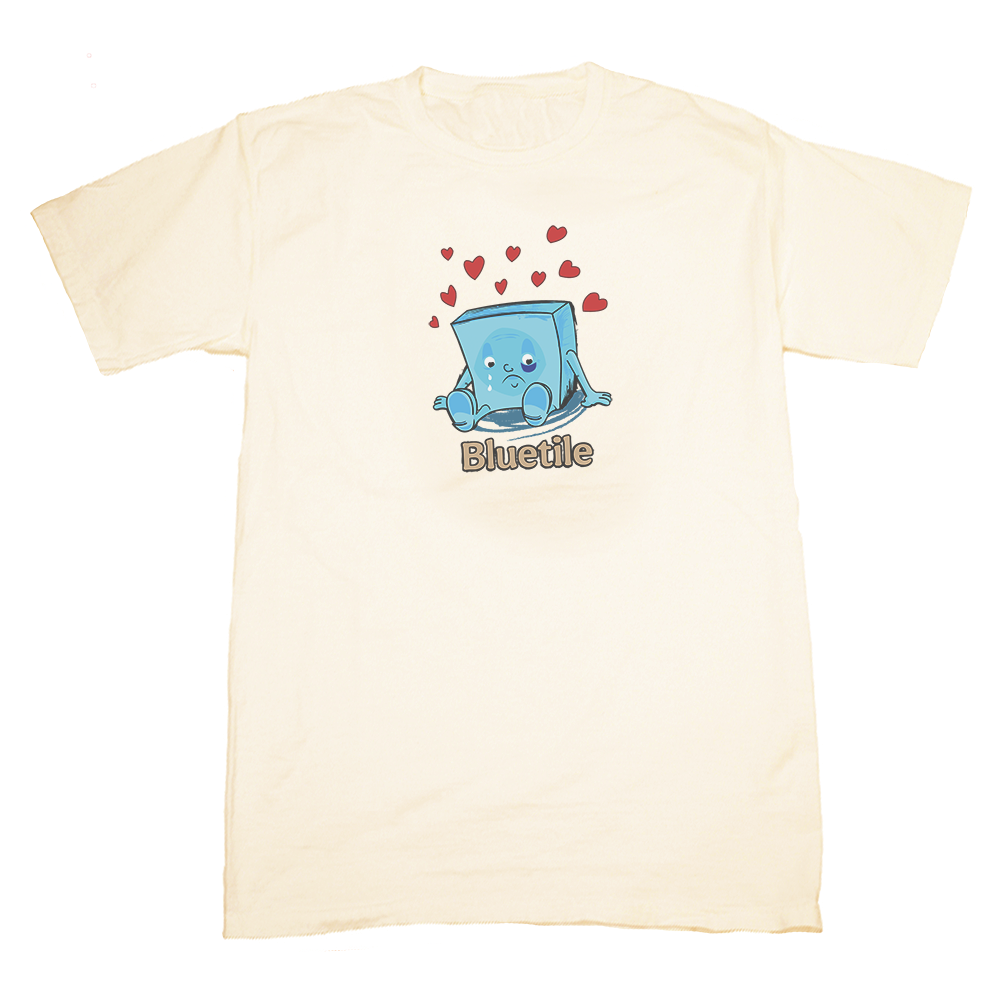 A BLUETILE SAD ALBERT SHIRT PARCHMENT with an image of a cube with hearts on it, perfect for those who love unique and eye-catching designs.