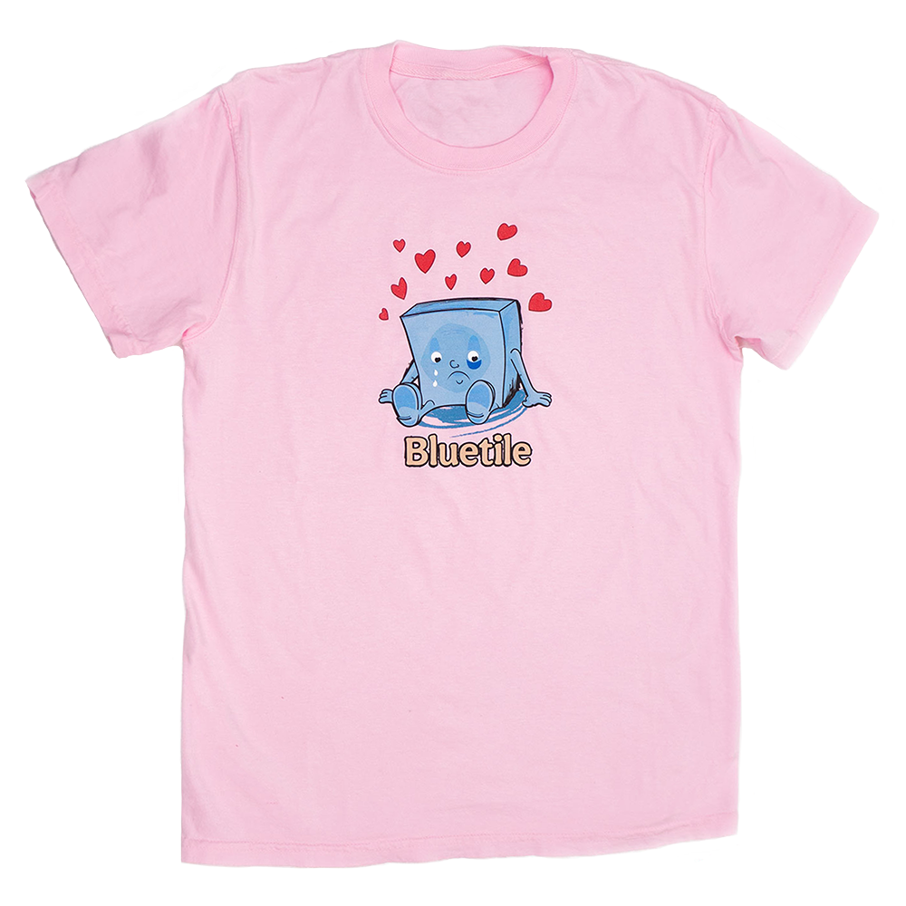 A Bluetile Skateboards pink t-shirt with an image of a cube with hearts on it.
