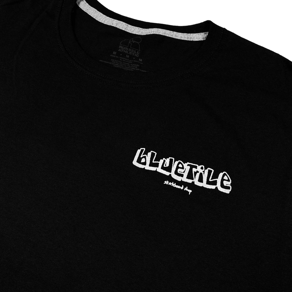 A Bluetile Skateboards black t-shirt featuring artwork with a white logo on it.