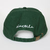 A BLUETILE X SPINA HEART & SQUARE HAT GREEN with the word schuttle written on it. Brand Name: Bluetile Skateboards