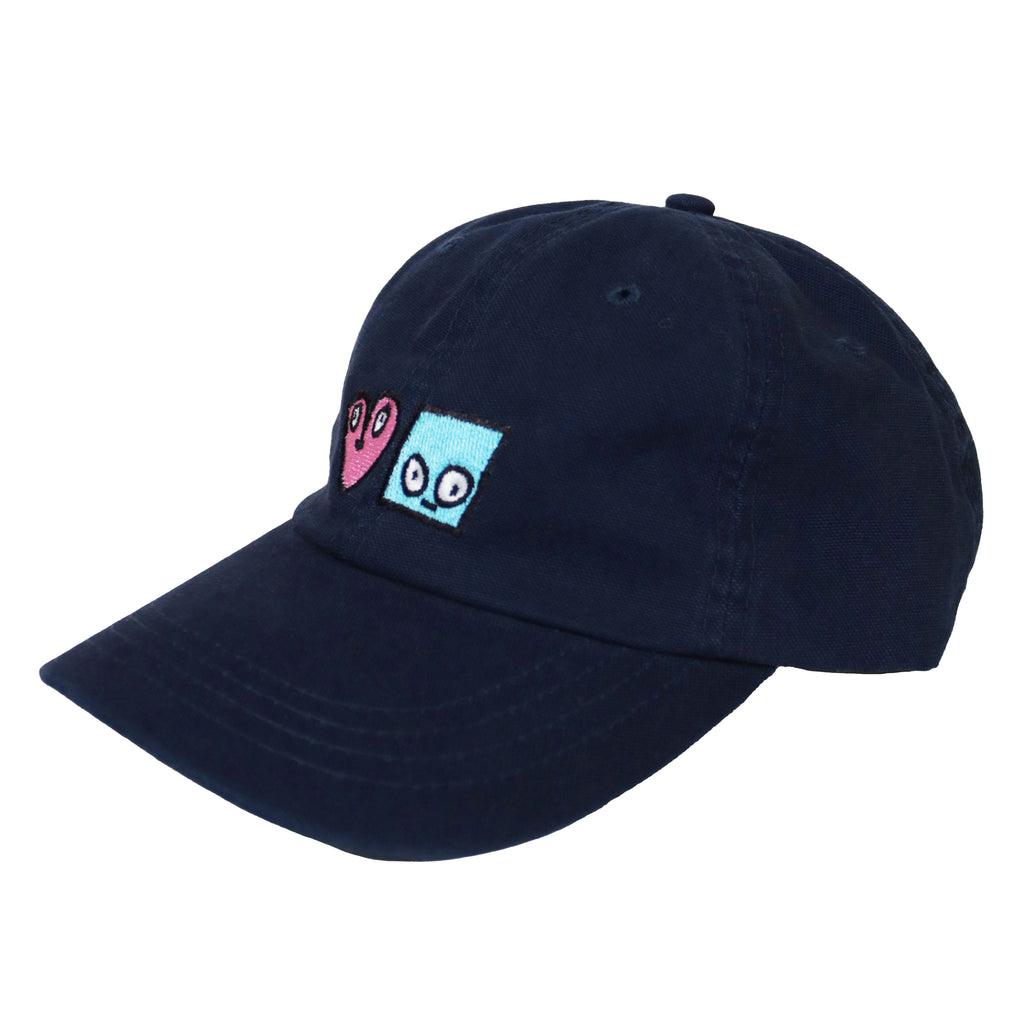 A BLUETILE X SPINA HEART & SQUARE HAT NAVY baseball cap with a heart on it.