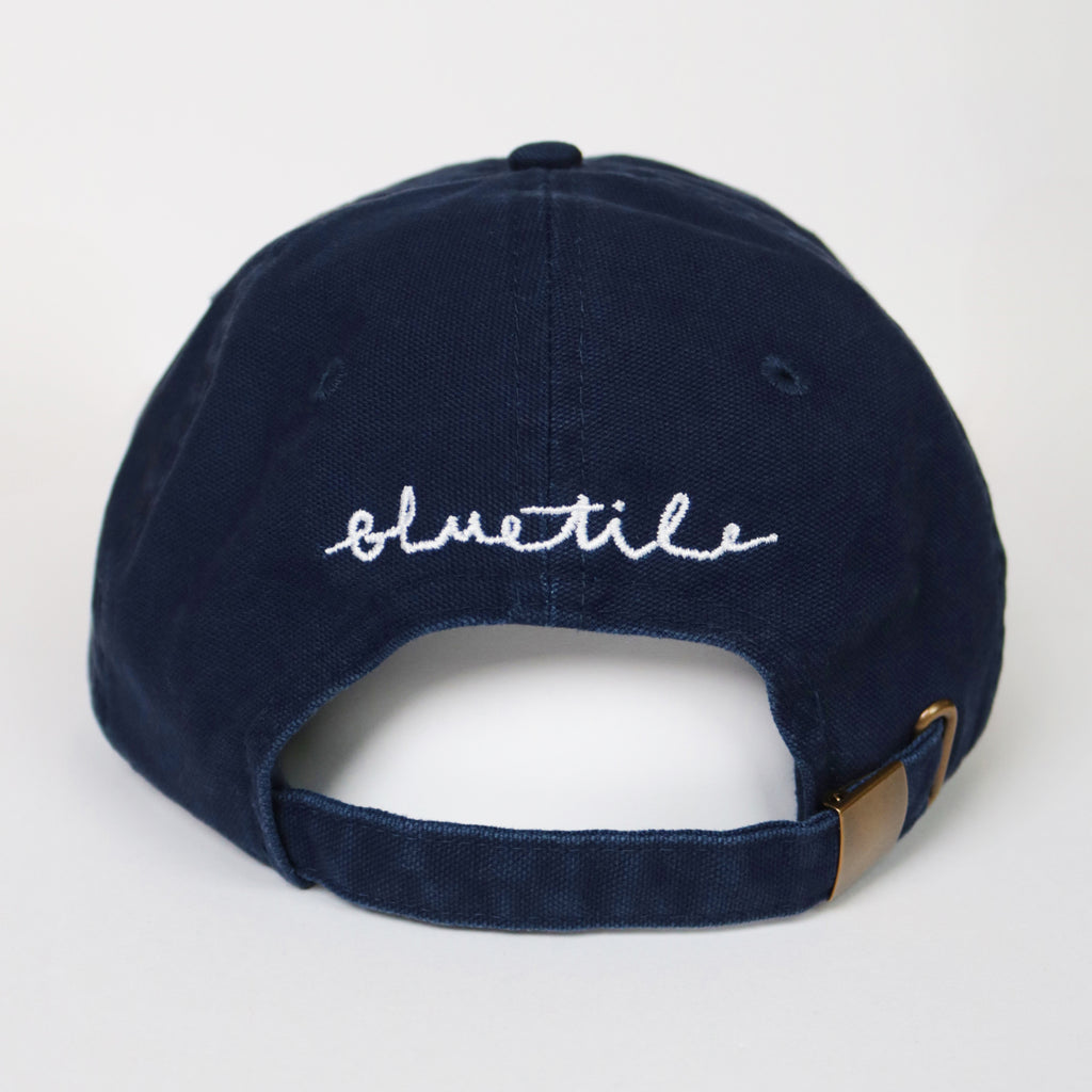 A BLUETILE X SPINA HEART & SQUARE HAT NAVY with the word Sullivan written on it, featuring a square design. (Brand Name: Bluetile Skateboards)