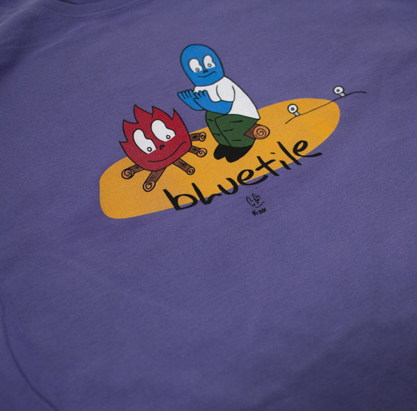 A BLUETILE CAMP FIRE T-SHIRT LAVENDER with a cartoon character on it.