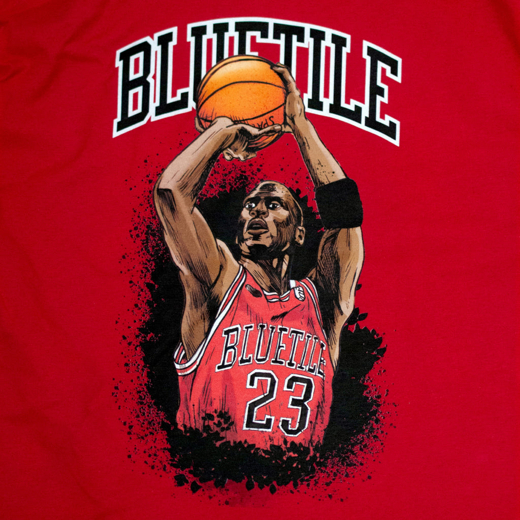 A BLUETILE JUMP SHOT LONG SLEEVE RED t-shirt with a basketball player on it by Bluetile Skateboards.