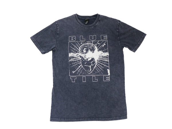 A Bluetile Skateboards "WOKE" T-shirt BLUE STONE with an image of a man on it.