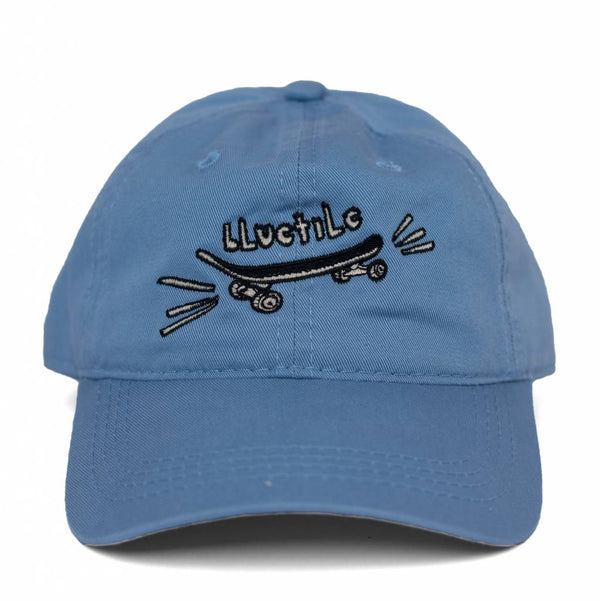 A BLUETILE "SKATE BORED" DAD HAT COLUMBIA BLUE, also known as a dad hat, is a blue hat with a skateboard on it. The brand name of this product is Bluetile Skateboards.