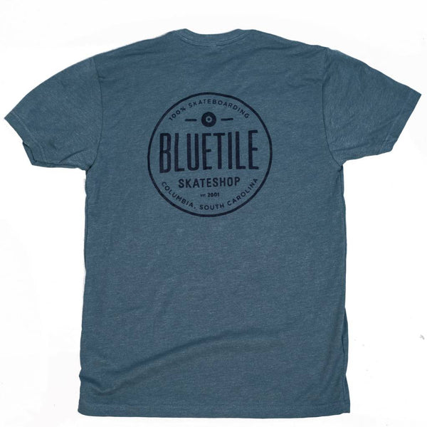 A cool Bluetile Skateboards blue t-shirt with the word bluetie on it.