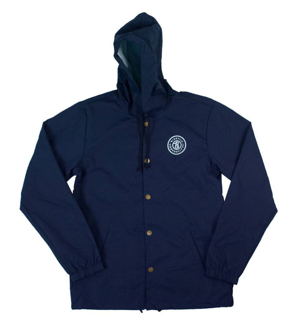 A Bluetile Skateboards navy jacket with a white logo on it.