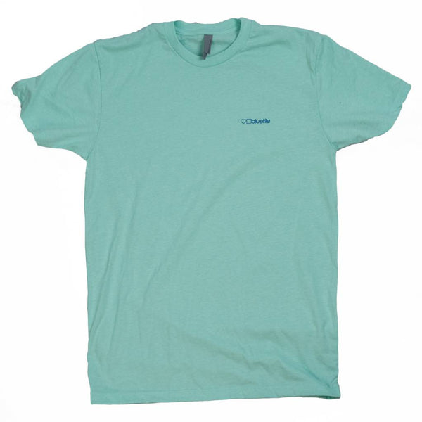 A Bluetile Skateboards mint green BLUETILE NO POCKET T-SHIRT with a blue logo on the pocket.