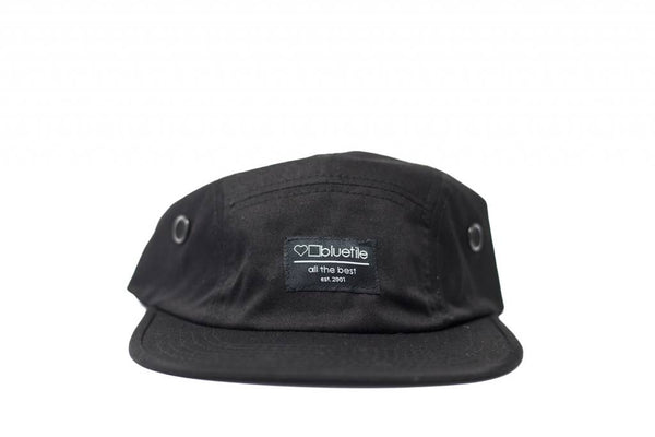 An adjustable BLUETILE SURPLUS 5 PANEL HAT BLACK with a Bluetile Skateboards label.