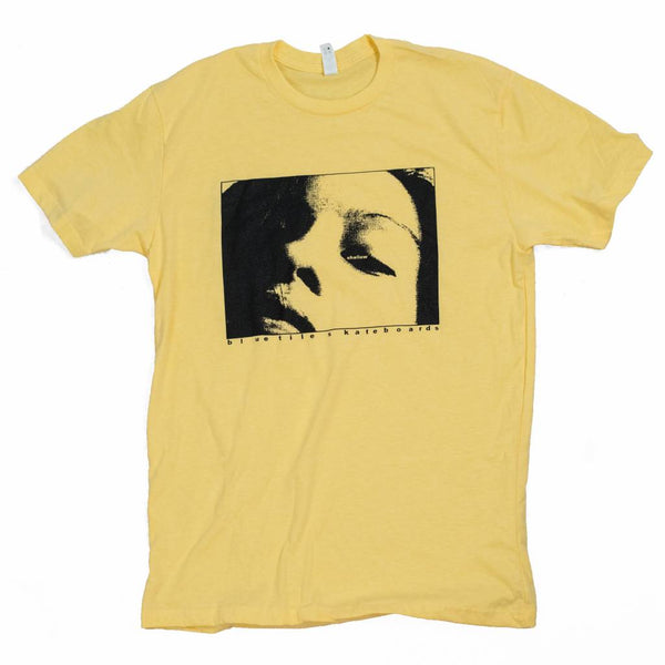 A BLUETILE X H. A. THOMAS "SHALLOW" YELLOW t-shirt designed by Andrew Thomas featuring the image of a woman's face. (Brand Name: Bluetile Skateboards)
