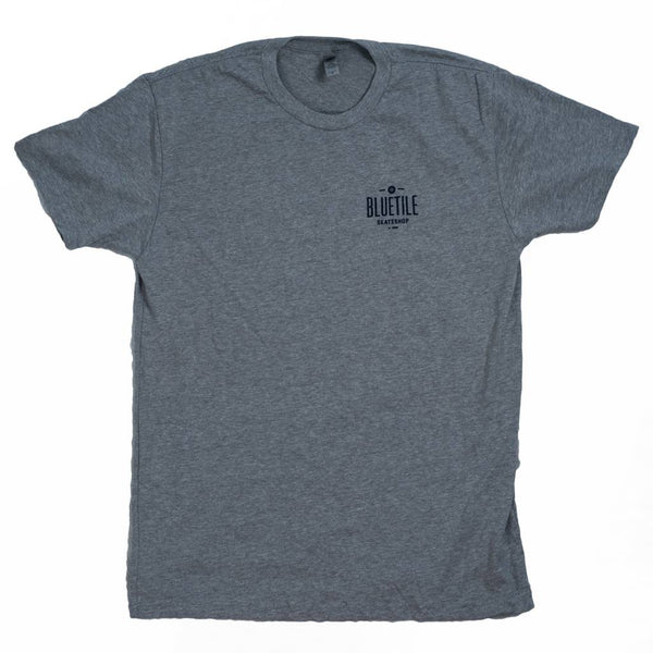 A BLUETILE 100% SKATEBOARDING GRAY/BLUE shirt with a logo on it.