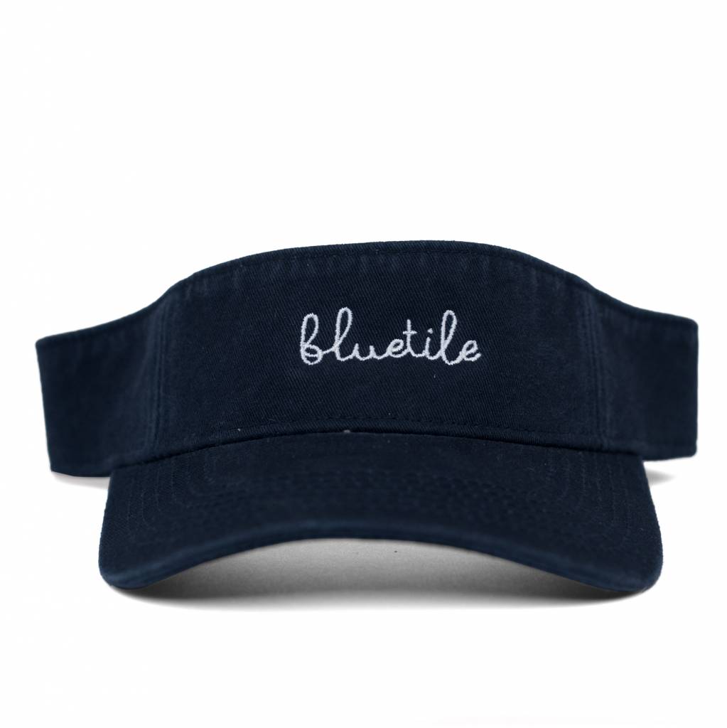 A BLUETILE SCRIPT VISOR NAVY with the word Bluetile Skateboards on it.