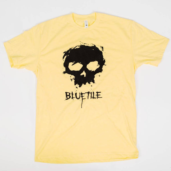 A limited edition ZERO X BLUETILE SKULL T-SHIRT YELLOW with a skull on it. (Brand Name: Bluetile Skateboards)