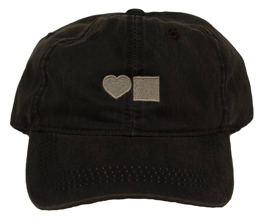 A BLUETILE WAXED CANVAS DAD HAT BROWN with a heart embroidered on it.