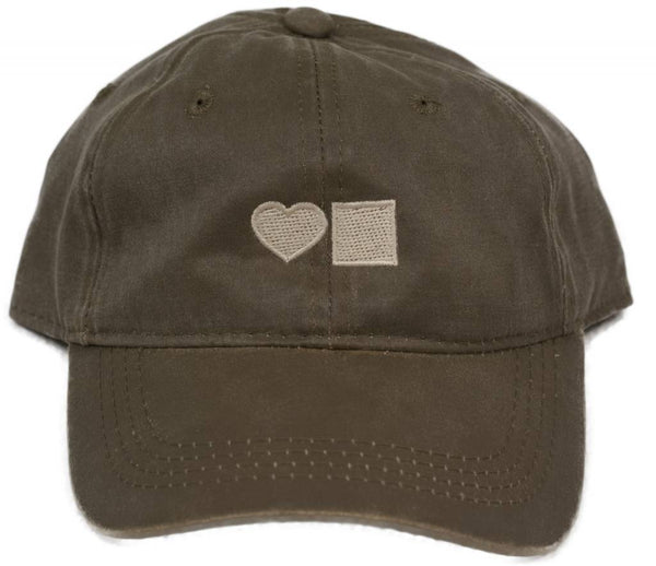 A Brown Bluetile Skateboards hat with a heart on it.