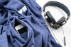A blue BLUETILE LOVE BLUETILE PREMIUM HOODIE with headphones in the pocket from Bluetile Skateboards.