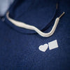 A BLUETILE LOVE BLUETILE PREMIUM HOODIE with a heart embroidered on it.