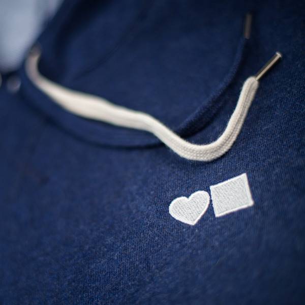 A BLUETILE LOVE BLUETILE PREMIUM HOODIE with a heart embroidered on it.