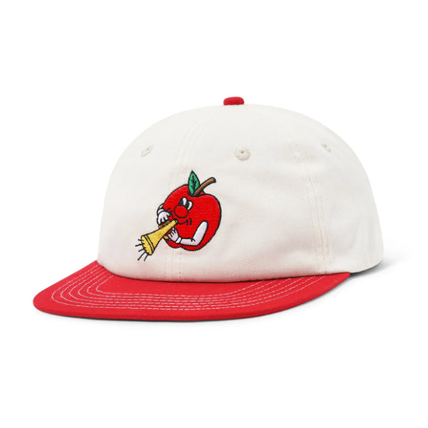 The Butter Goods Apple 6 Panel Cap Natural/Cherry features a white and red design with an embroidered cartoon apple blowing a yellow horn on the front.