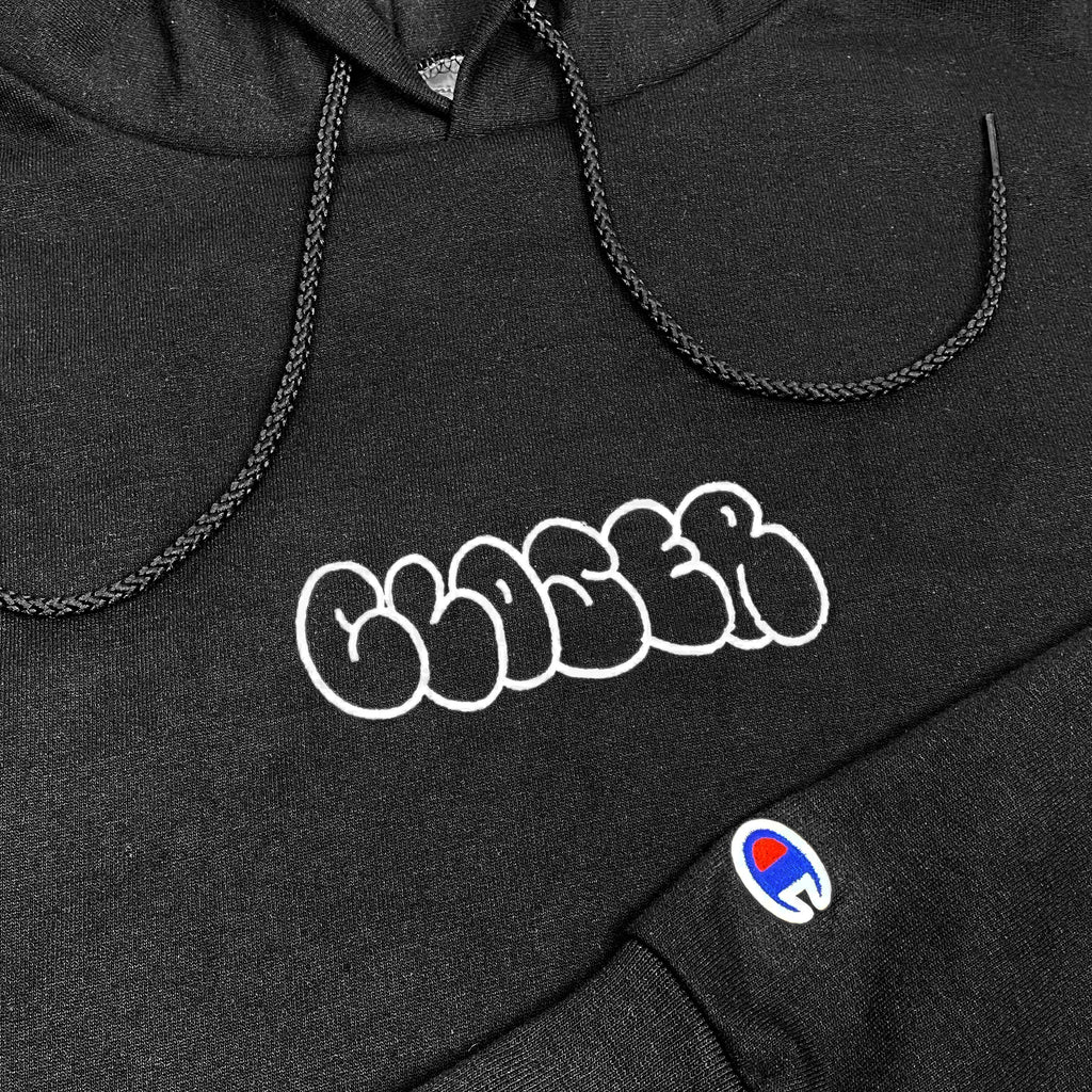 A CLOSER BUBBLE HOODIE BLACK with a white logo on it.