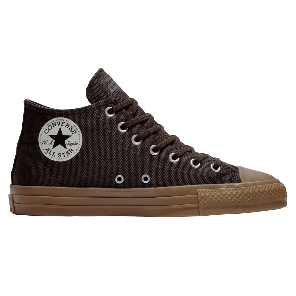 A pair of CONVERSE CONS CTAS PRO MID VELVET BROWN / EGRET / DARK GUM sneakers with a white star on the side.